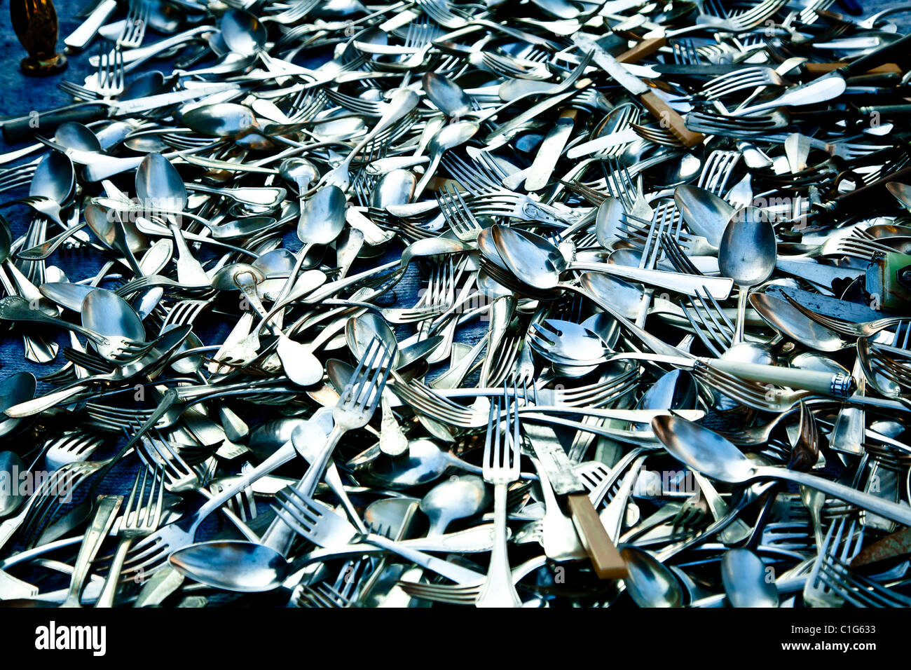 Pile of cutlery. Street market near the bridge of Alexandre III. Paris