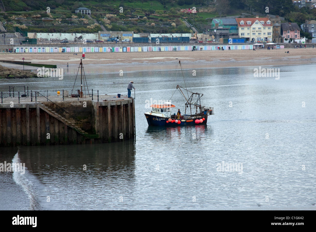 Fishing Boat returning to Lyme Regis Harbour Dorset England UK Stock ...