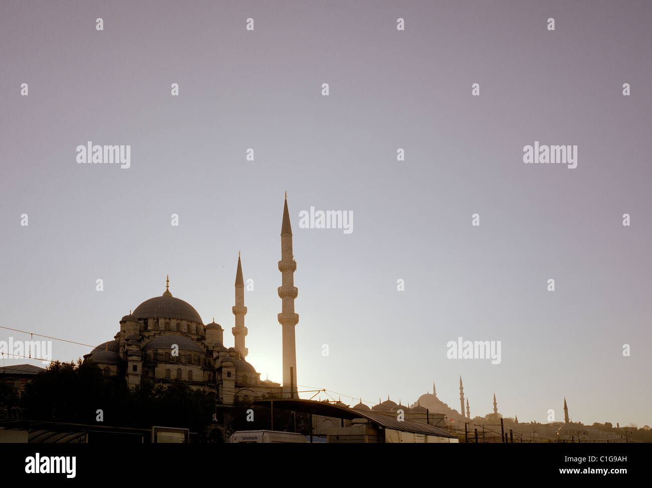 Twilight at the New Mosque Yeni Camii in Istanbul in Turkey in Middle East Asia. Sunset Dusk Ethereal City Sky Minaret Architecture Escapism Travel Stock Photo