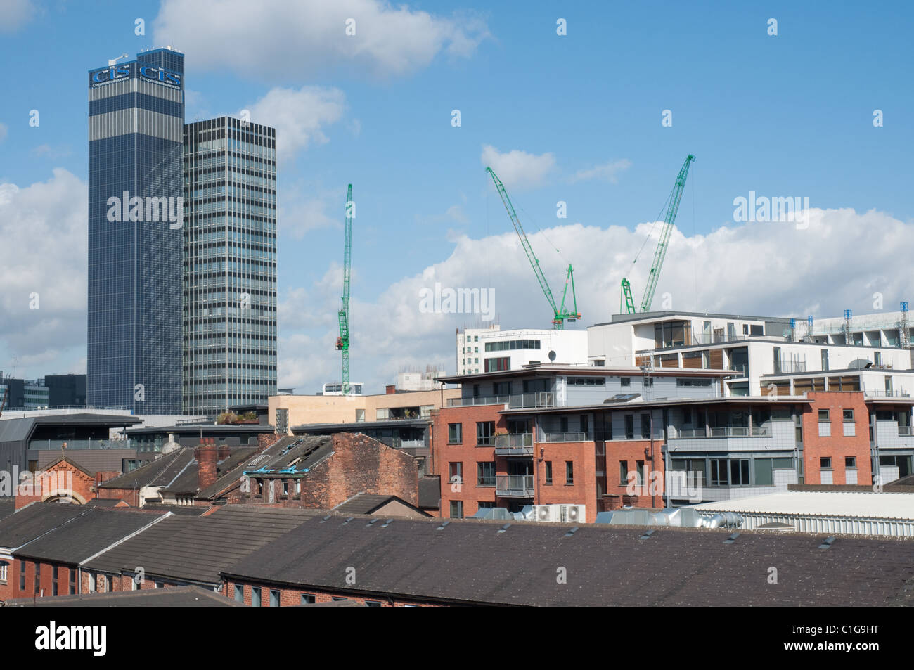 City centre Manchester, old property in the foreground new apartments