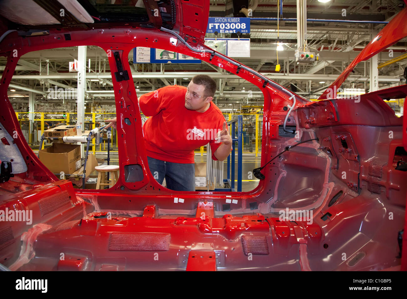 Workers assemble the 2012 Ford Focus at Ford Motor Co.'s Michigan