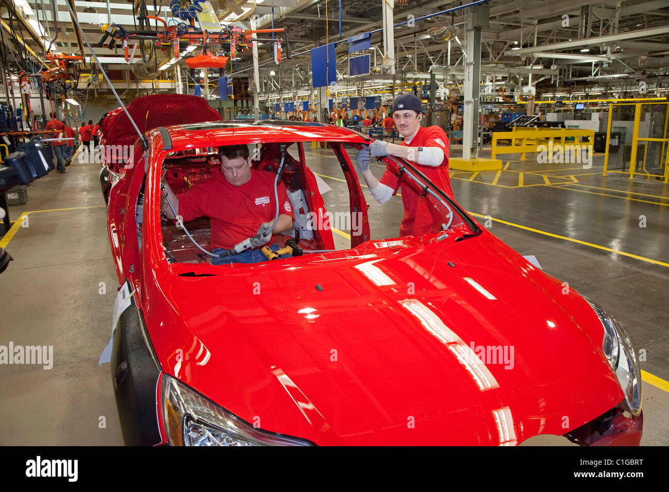 Workers assemble the 2012 Ford Focus at Ford Motor Co.'s Michigan