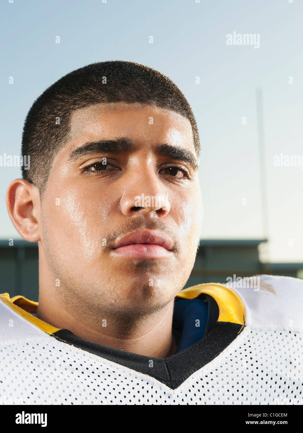 Serious Hispanic football player Stock Photo - Alamy