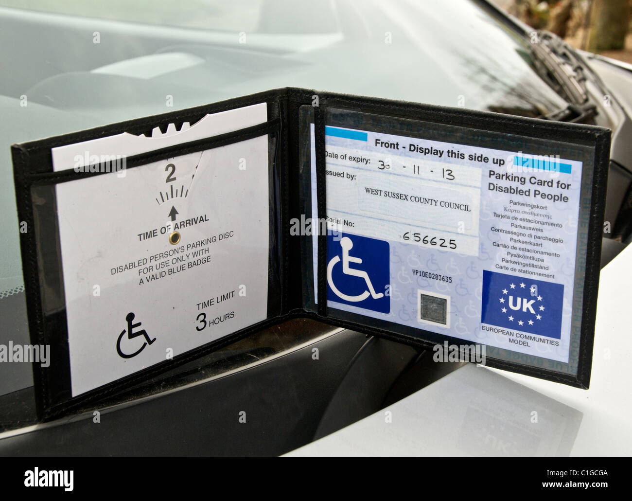 Blue Badge disabled driver parking permit allows UK holders parking privileges. Stock Photo