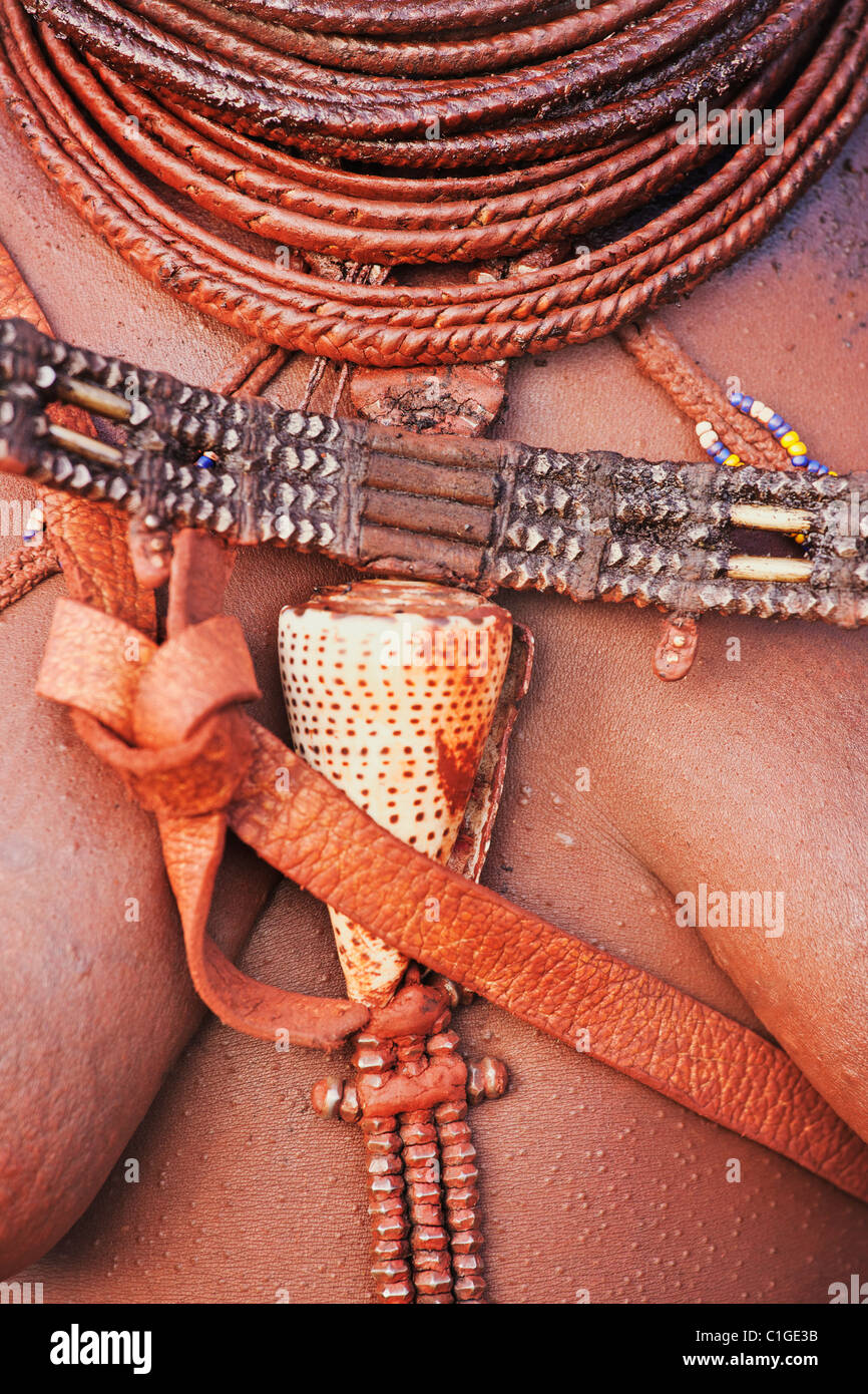 Jewelery worn by Himba woman in traditional dress who live in the Kunene Region, Namibia Stock Photo