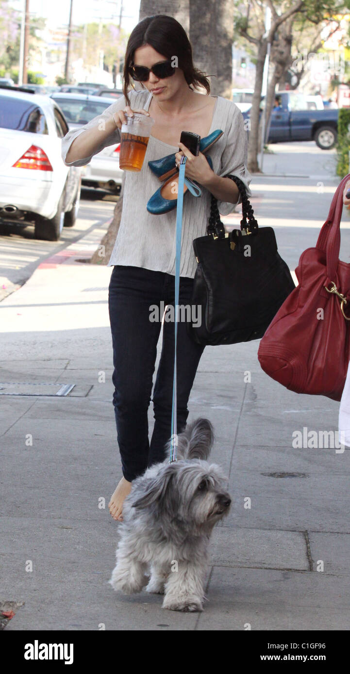 Rachel Bilson leaves a restaurant with a friend and her dog. The
