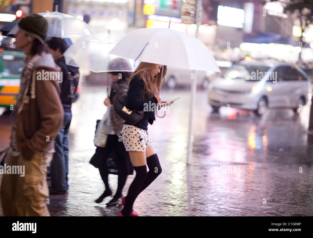 Woman walk in the street with umbrella, Shibuya, Tokyo, Japan Stock Photo -  Alamy