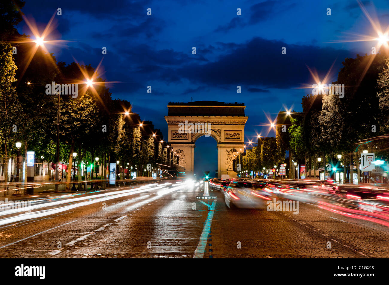 France, Paris, Champs Elysees and Arc de Triomphe dusk Stock Photo