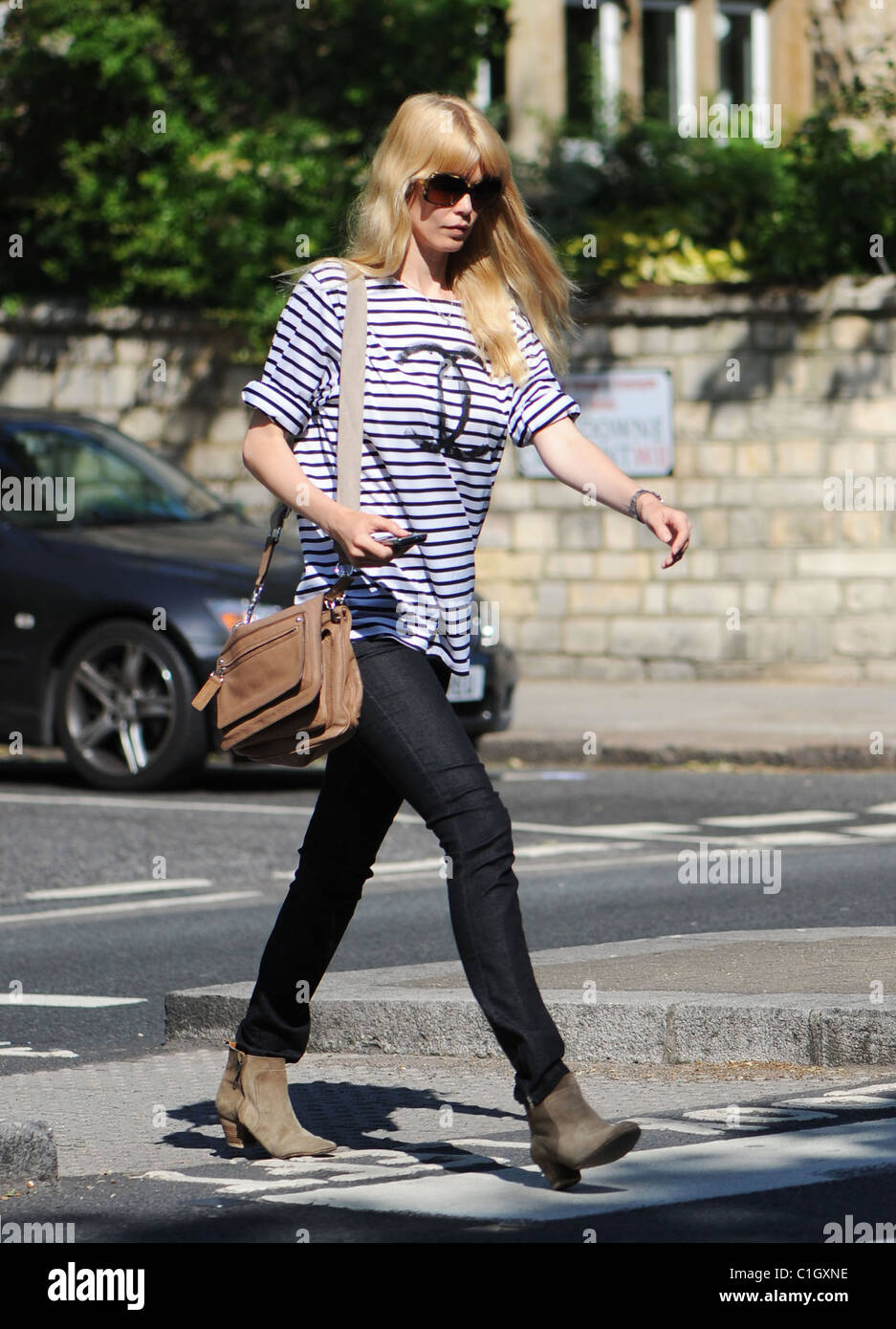 Claudia Schiffer looks stylish as she returns home after dropping her