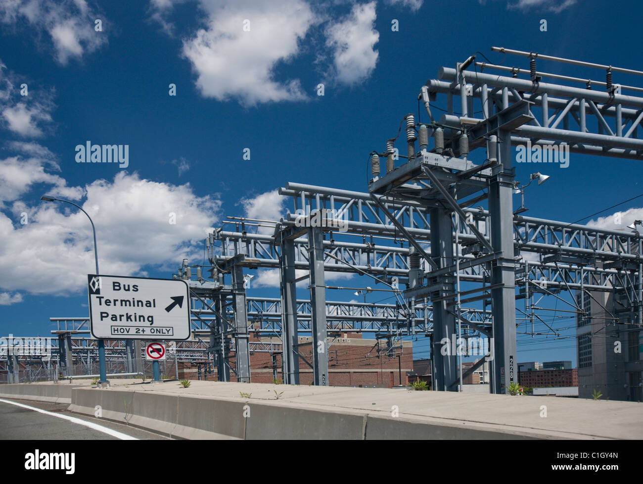 Bus terminal parking and power grid with Fort Point Channel in the background, Boston, Massachusetts, USA Stock Photo