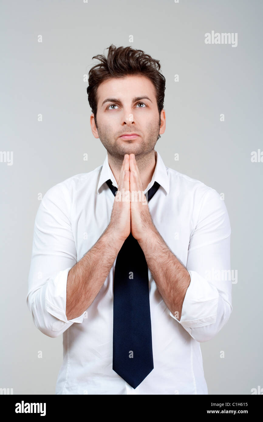 Businessman hands together in prayer hi-res stock photography and ...