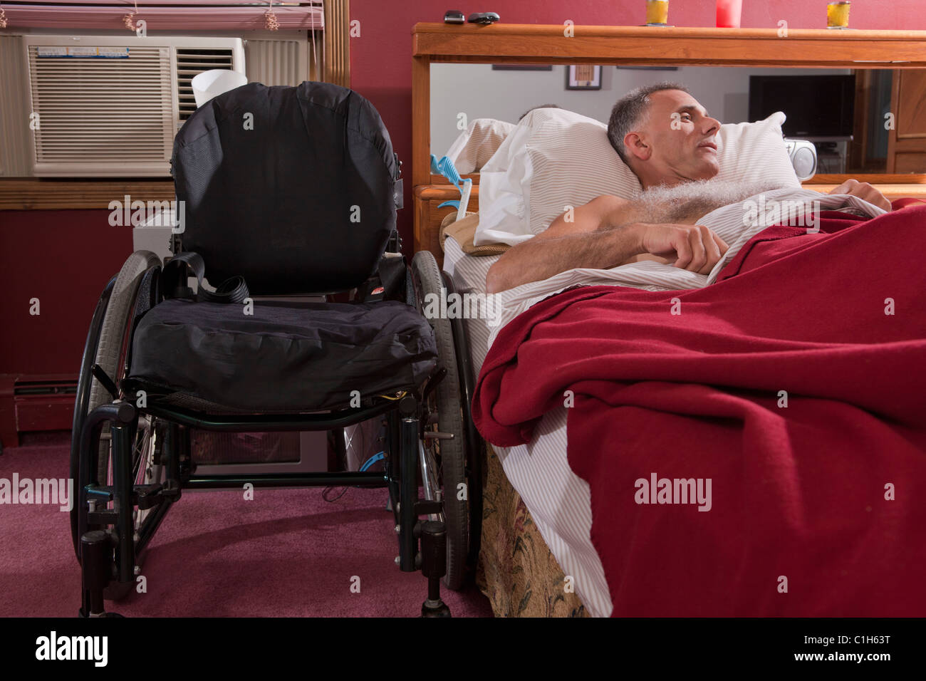 Man with spinal cord injury sleeping on the bed Stock Photo Alamy
