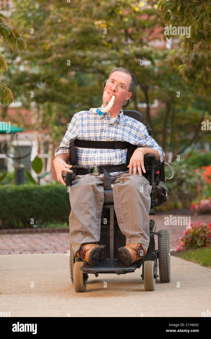 Man in wheelchair with breathing tube Stock Photo Alamy