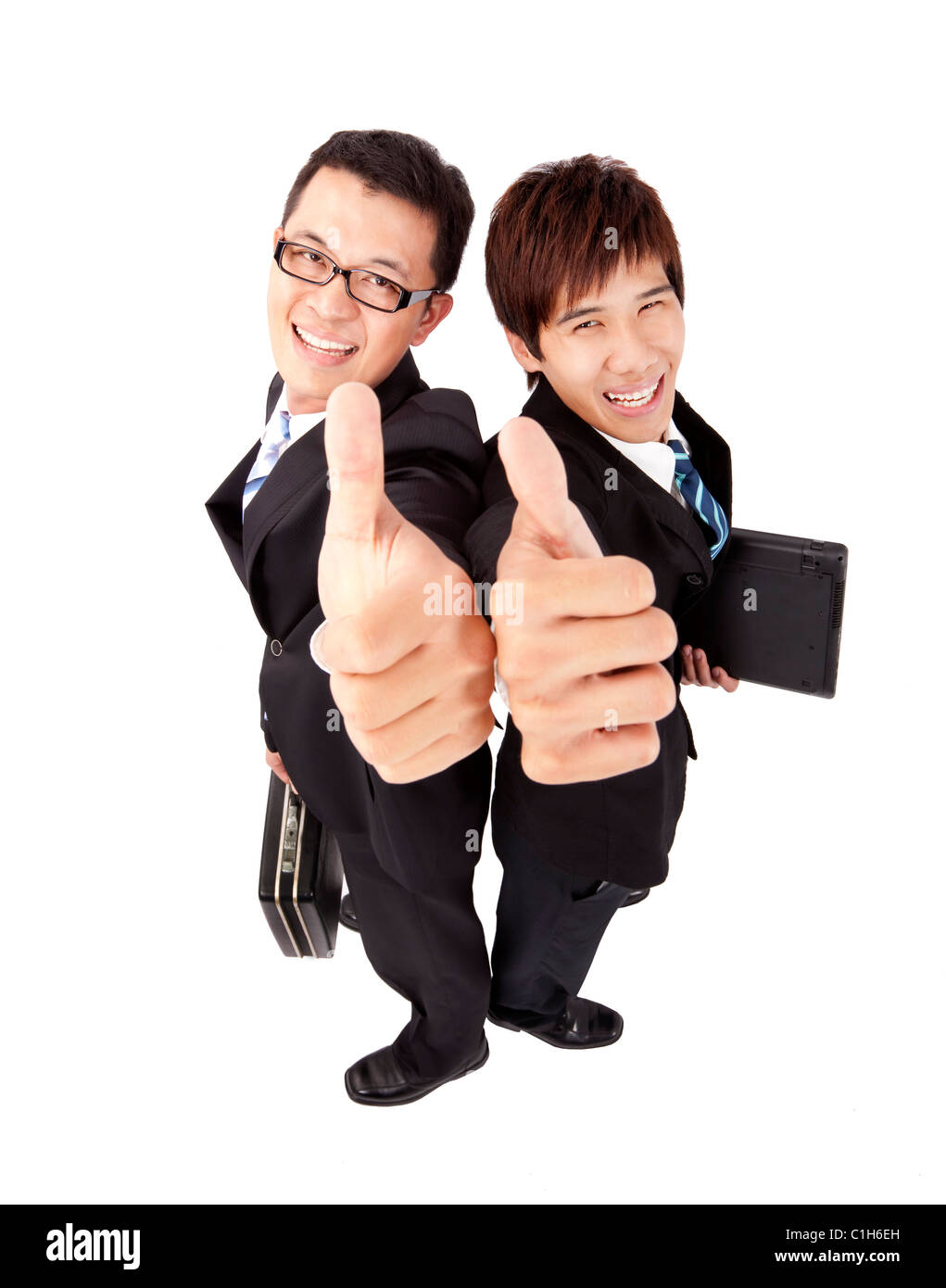 Two successful businessman with thumb up Stock Photo
