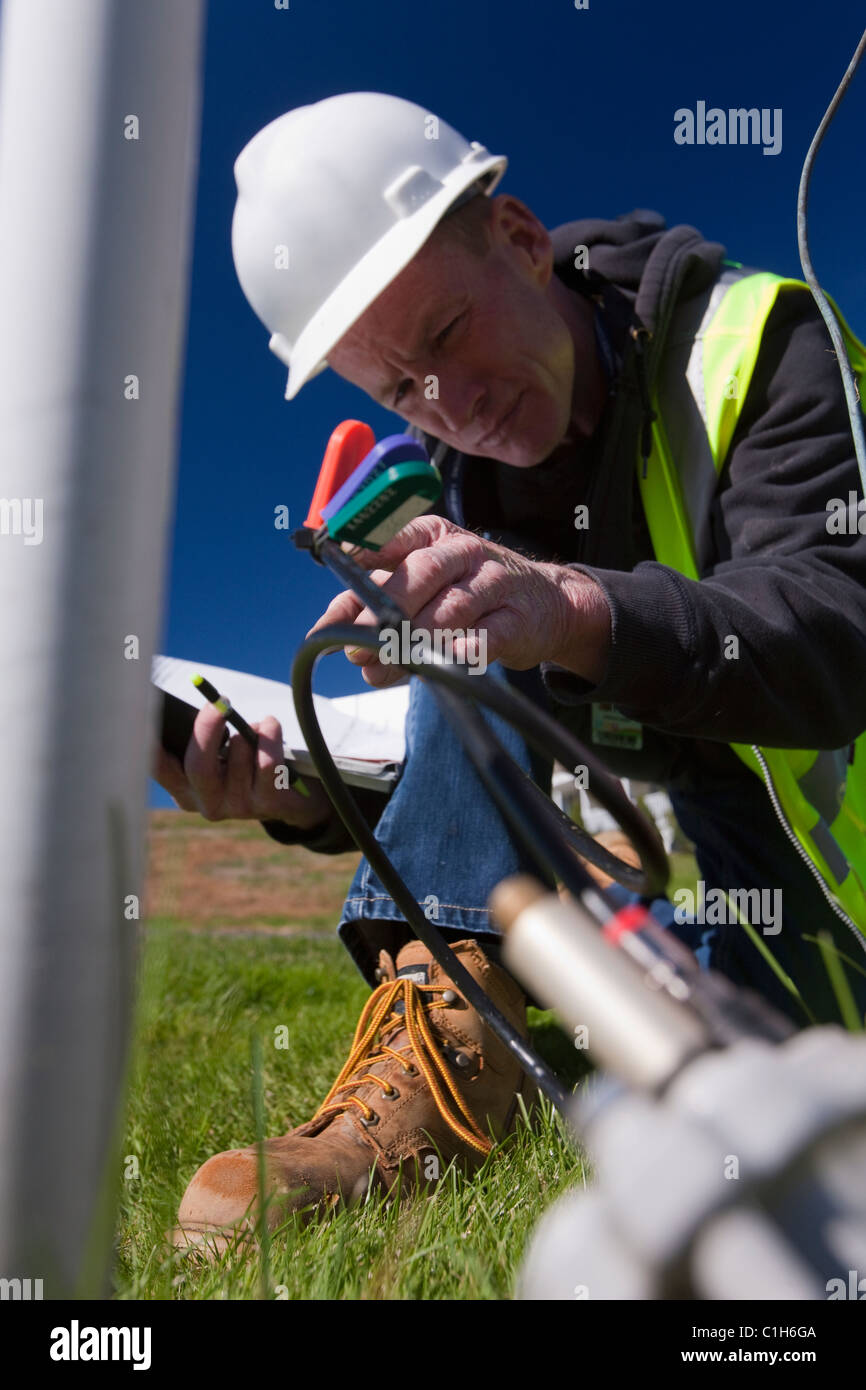Cable installer working on wiring outside a house Stock Photo Alamy