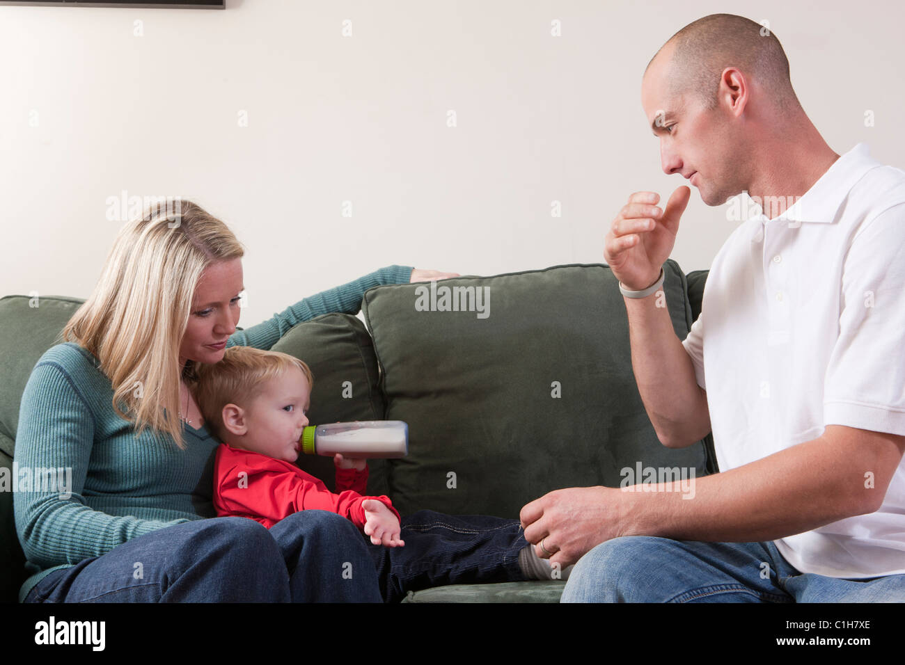 Man signing the word 'Drink' in American Sign Language while his son