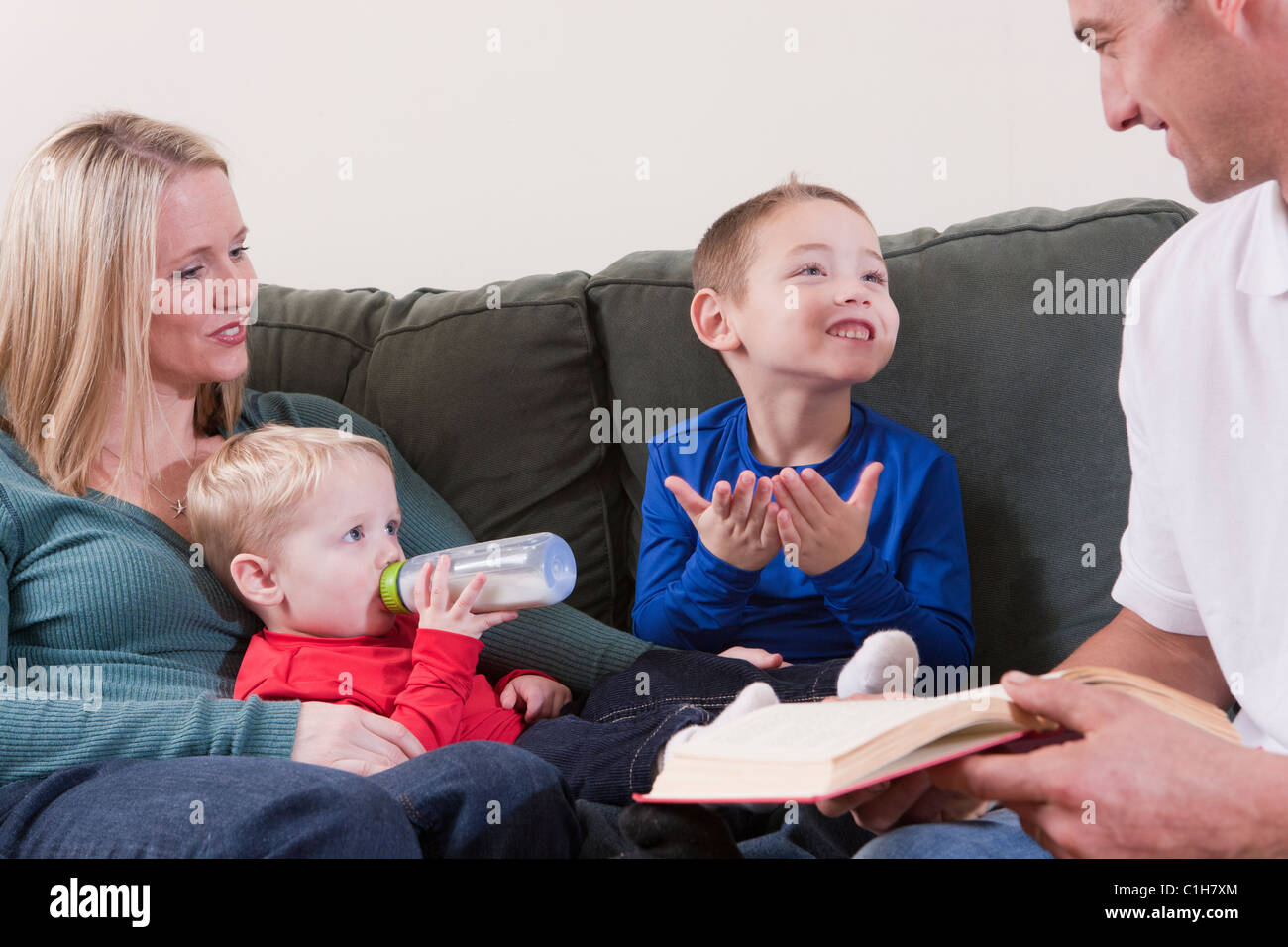 Boy signing the word 'Book' in American Sign Language while studying