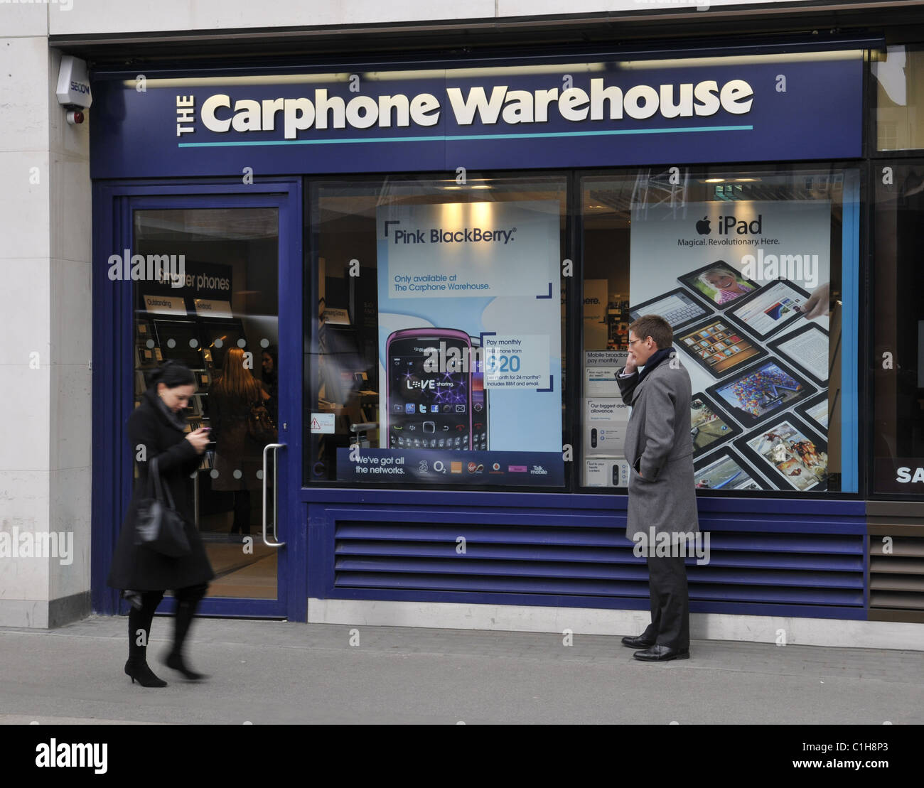 A general view of a The Carphone Warehouse with members of the public speaking on mobile phones Stock Photo