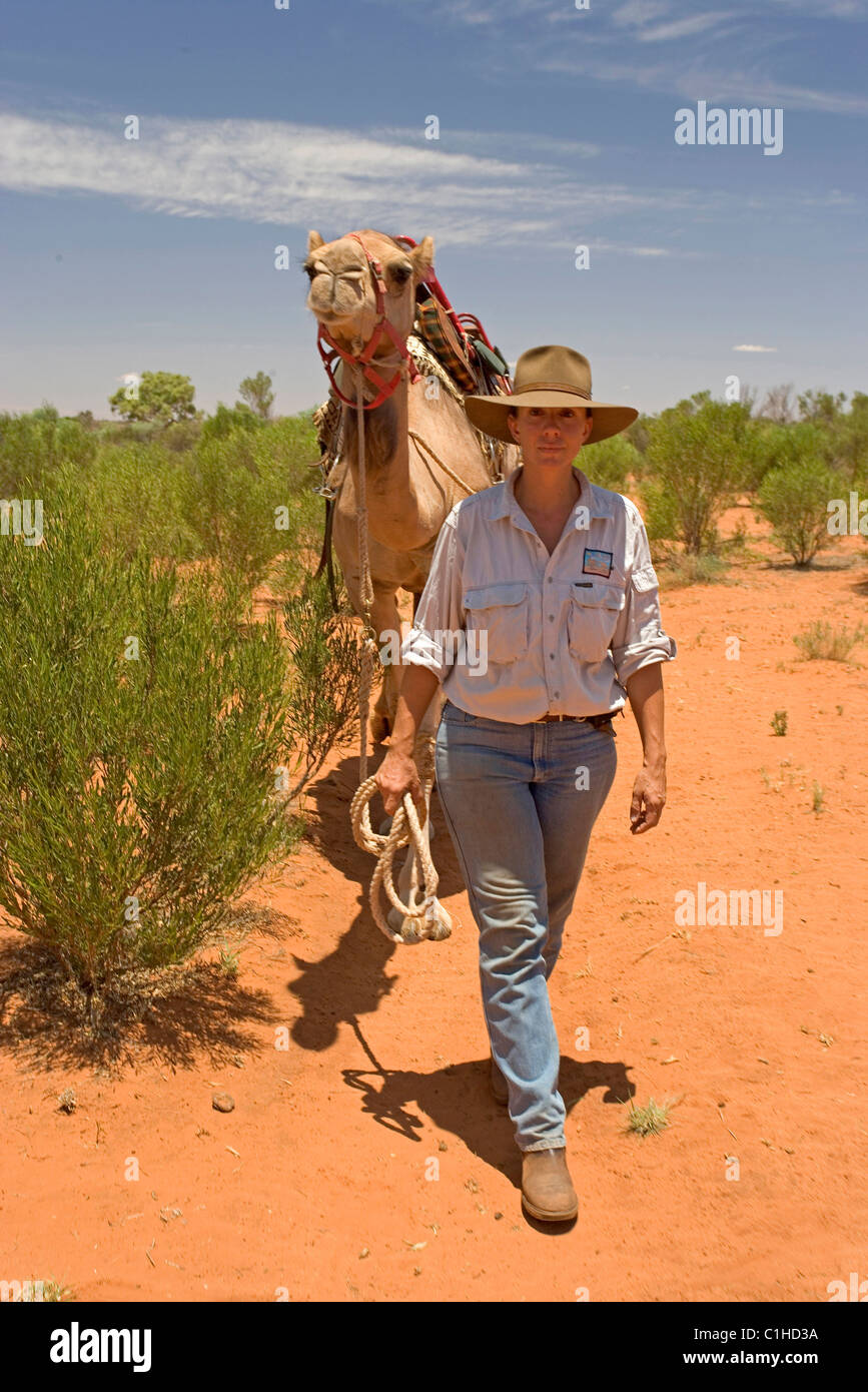 Australia, Northern Territory, Kings Creek, Camel riding with the guide ...