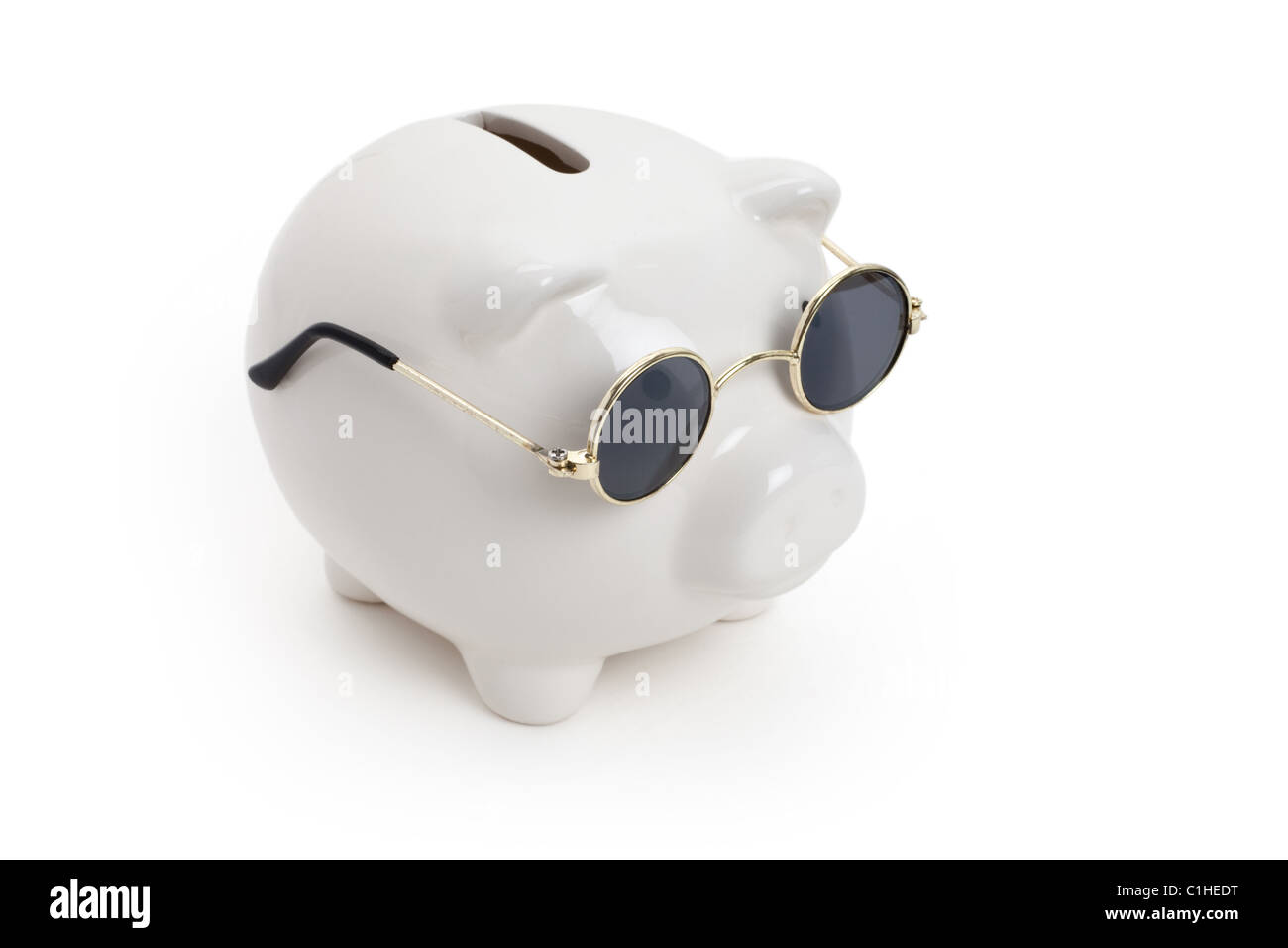 Piggy Bank and Sunglasses , concept of savings Stock Photo