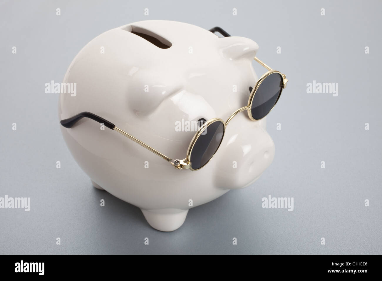 Piggy Bank and Sunglasses , concept of savings Stock Photo