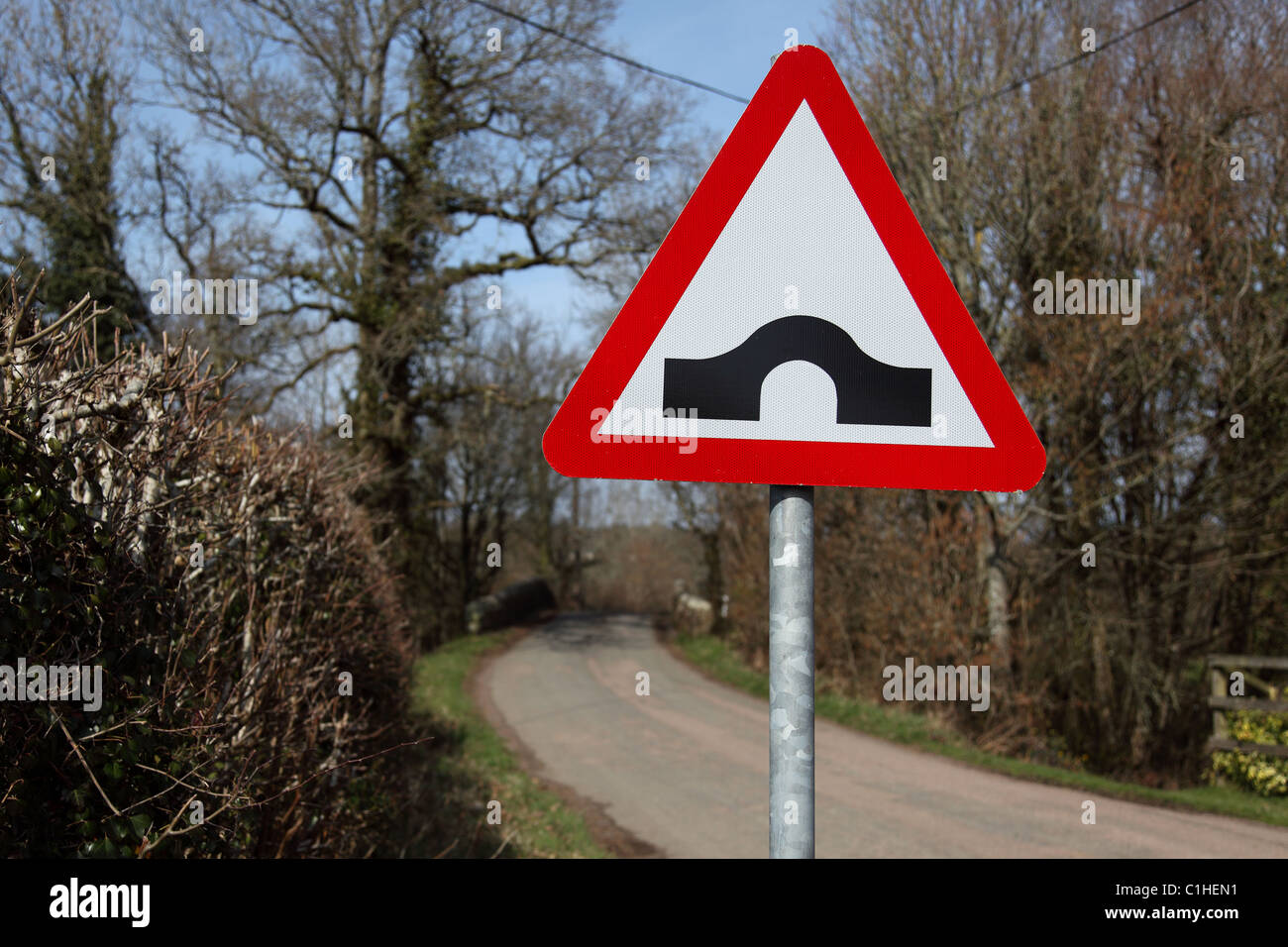 Road sign showing a Hump Back Bridge in the countryside of Devon England UK Stock Photo