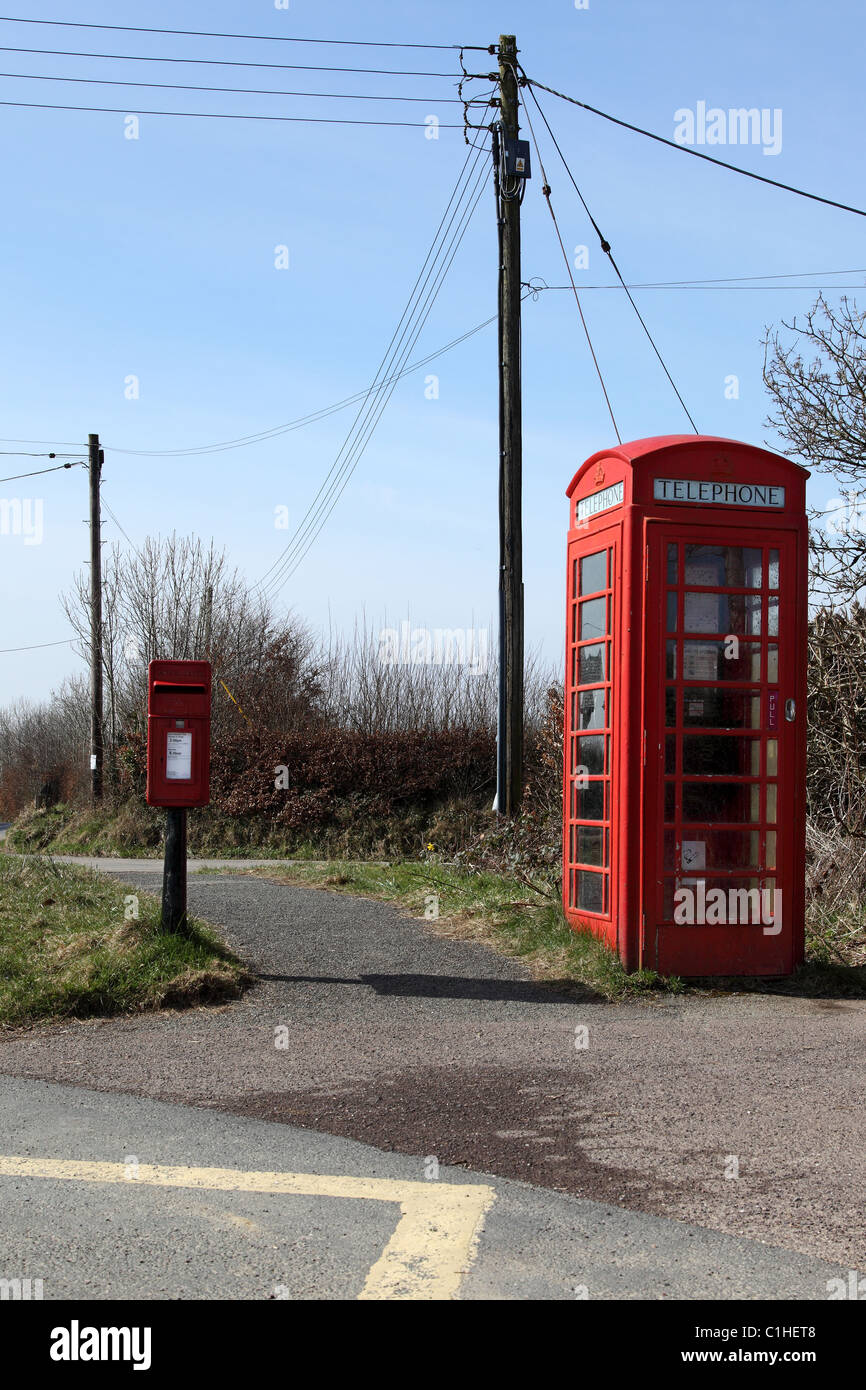 Red Telephone Box and Red Post Box with telephone wires crossing road