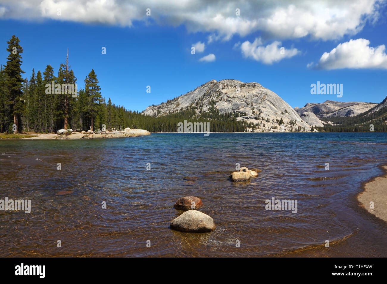 Flat shore of picturesque shallow lake at Tioga Pass Stock Photo