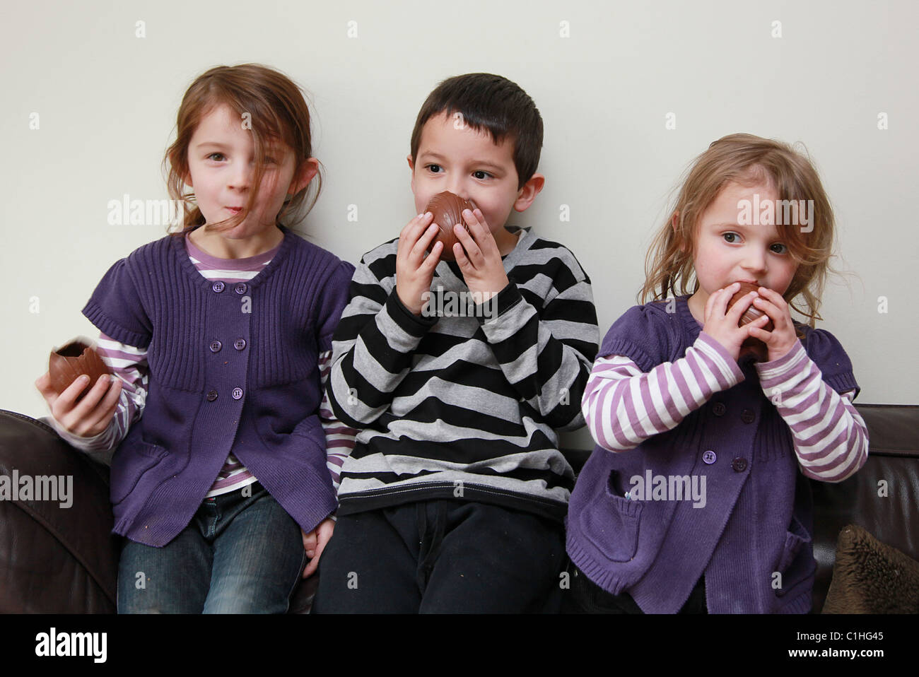 Children eating chocolate Easter Eggs, UK Stock Photo Alamy