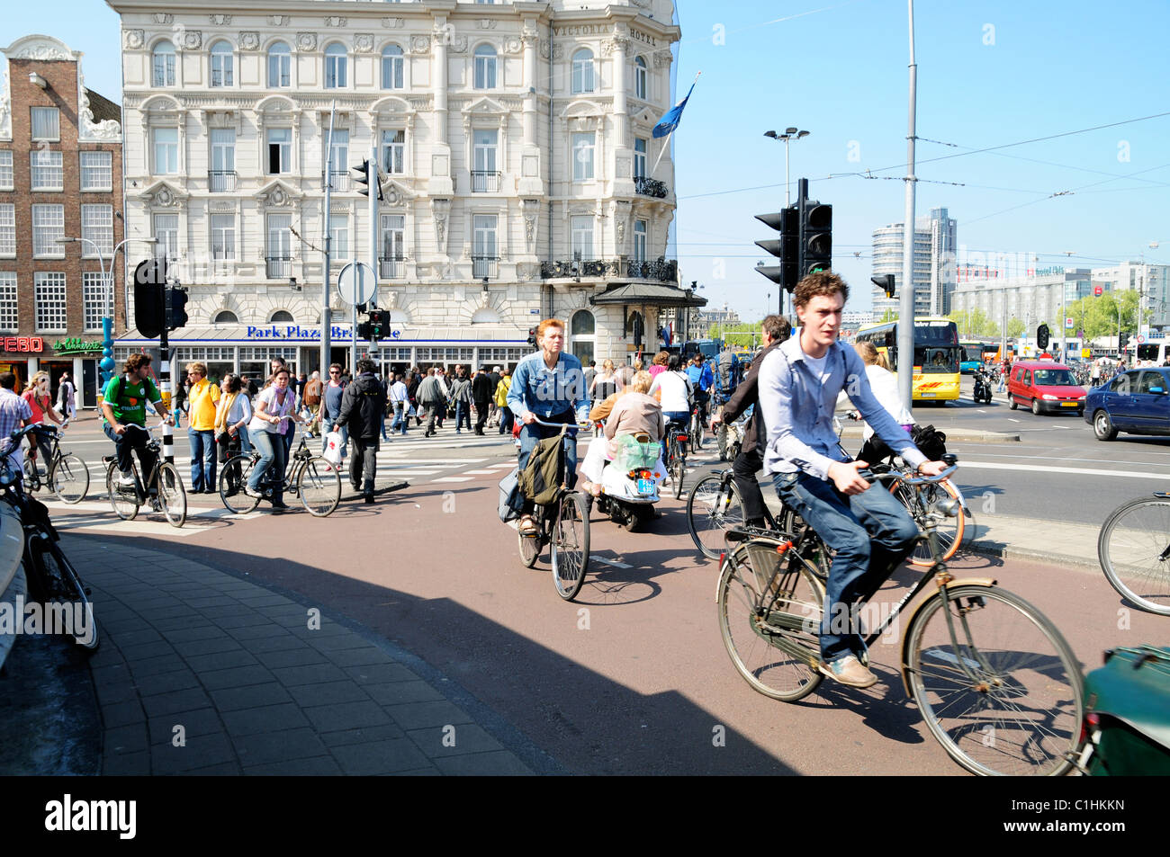 People riding bikes outside Amsterdam Train Station Stock Photo Alamy