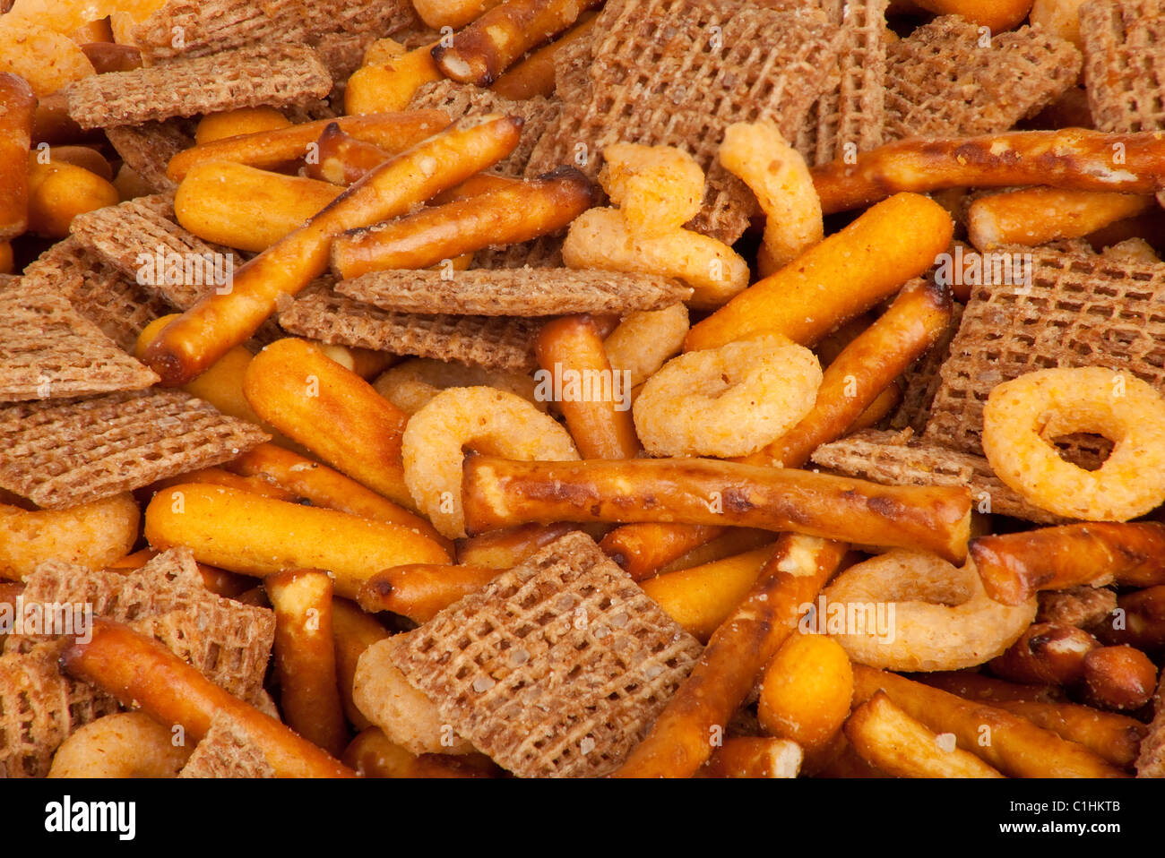 This is a mix of salted pretzels, cereal squares and cheezy bread crisps. Stock Photo