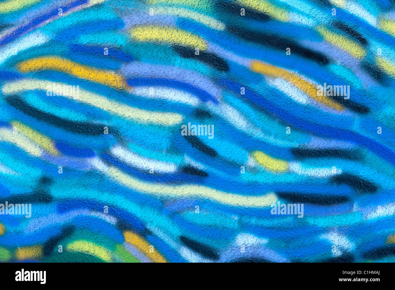 A close up of a colorful stucco wall for use as a design element or background. Stock Photo