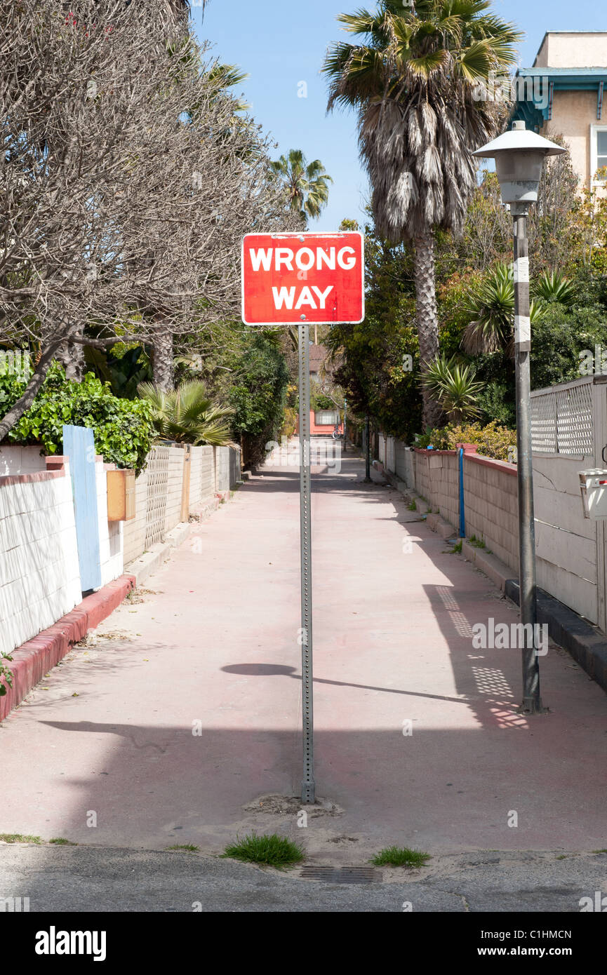 Bad Way Line A wrong way sign in front of an alleyway to fend off traffic from ...