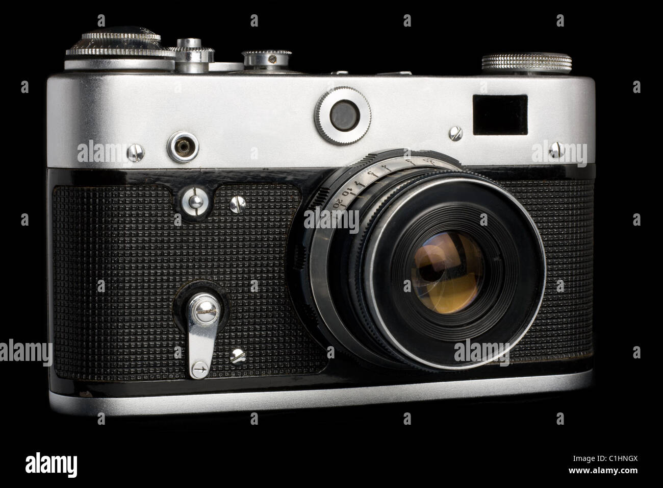 Old used film camera isolated over black Stock Photo Alamy