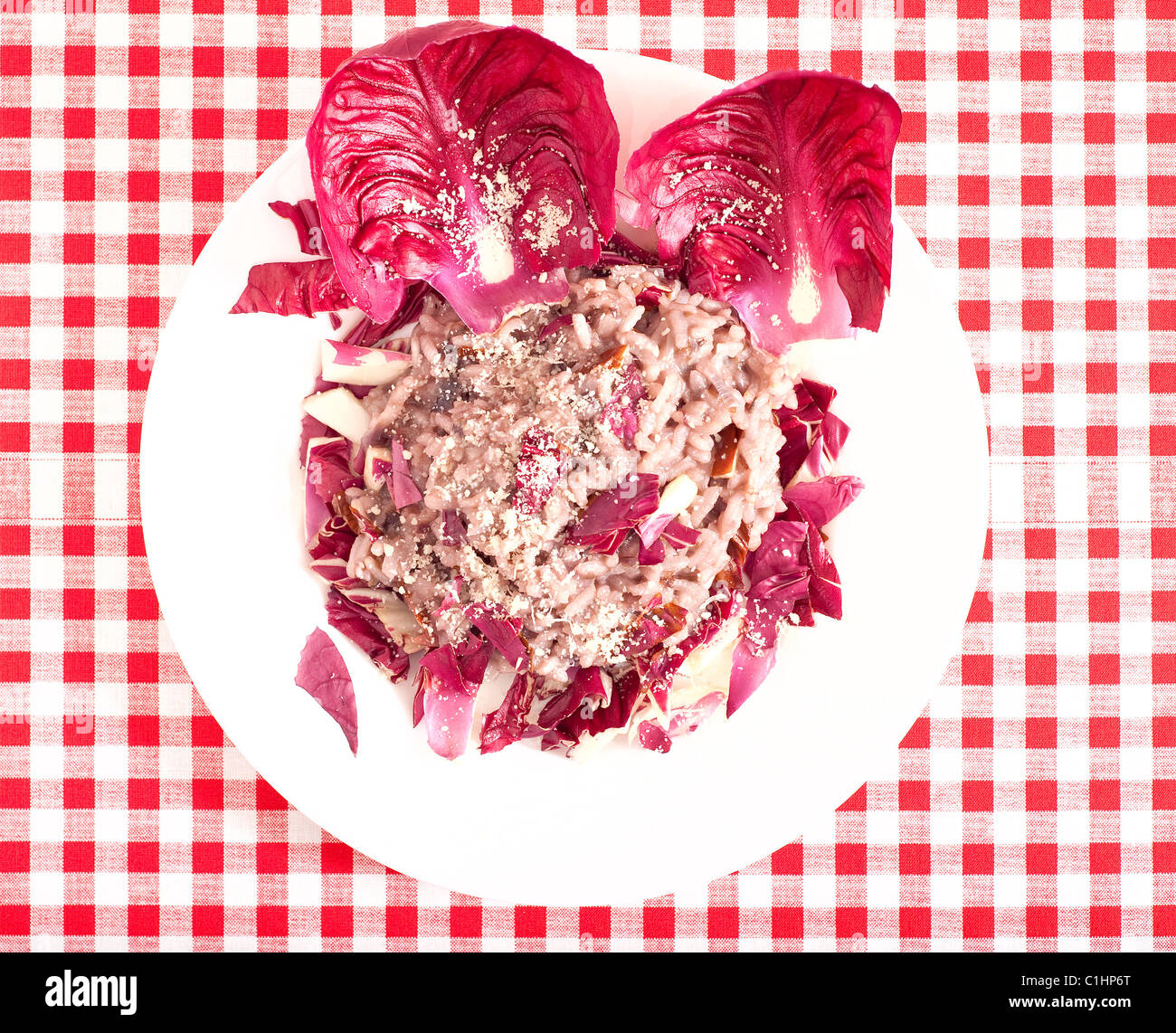 Rice with red chicory in a plate, a popular dish in North Italy Stock ...
