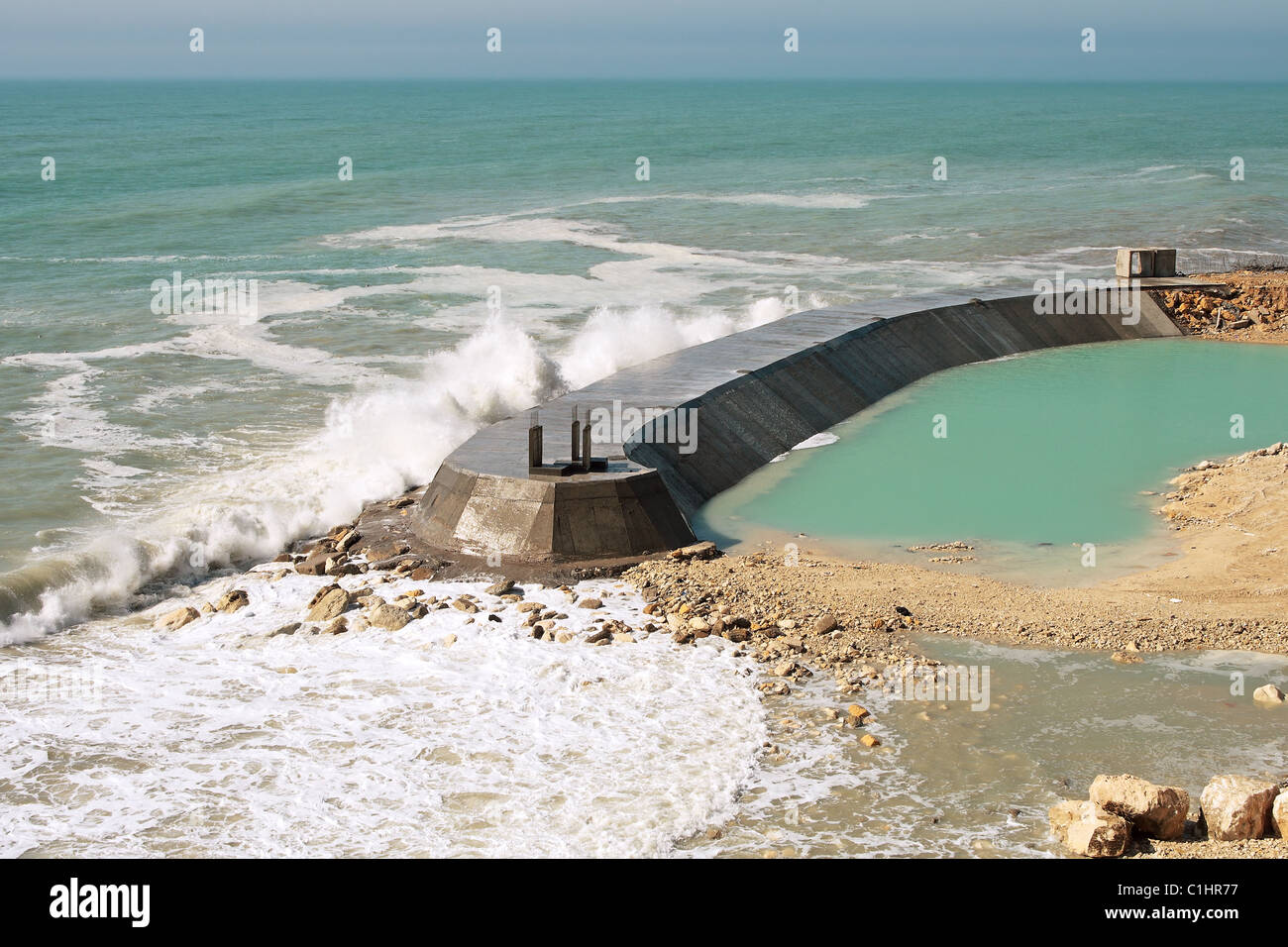 Construction of the dam, view from the top. Caspian Sea. Aktau. Stock Photo