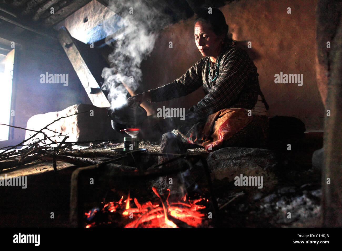 Nepali woman in the traditional kitchen in the Himalaya Nepal Stock
