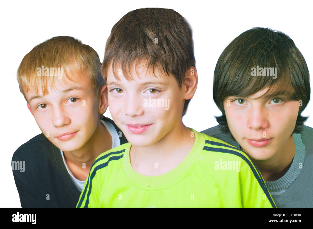 three young men standing on a white background Stock Photo - Alamy