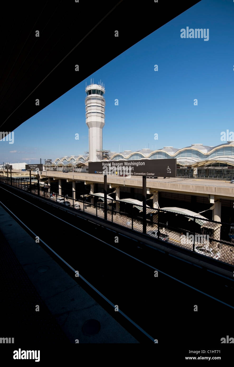 Ronald Reagan Washington National Airport sign and control tower. An artistic view from the metro rail station. Stock Photo