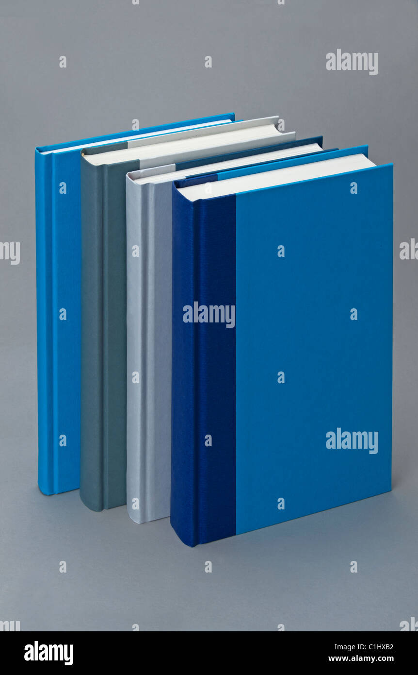 Four Plain books, standing in a stack Stock Photo