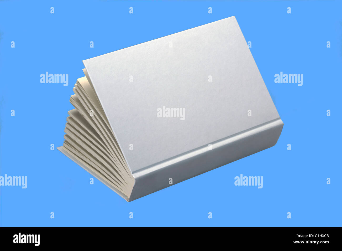 Open white book isolated on blue background, for design layout Stock Photo