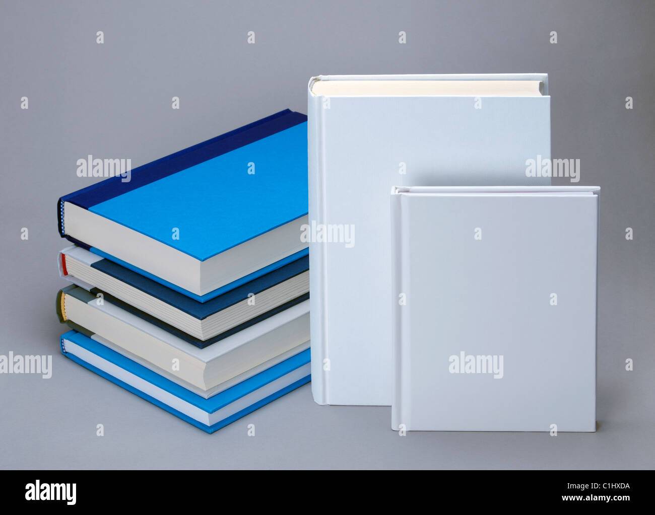 Two white plain and four colour books for design layout Stock Photo