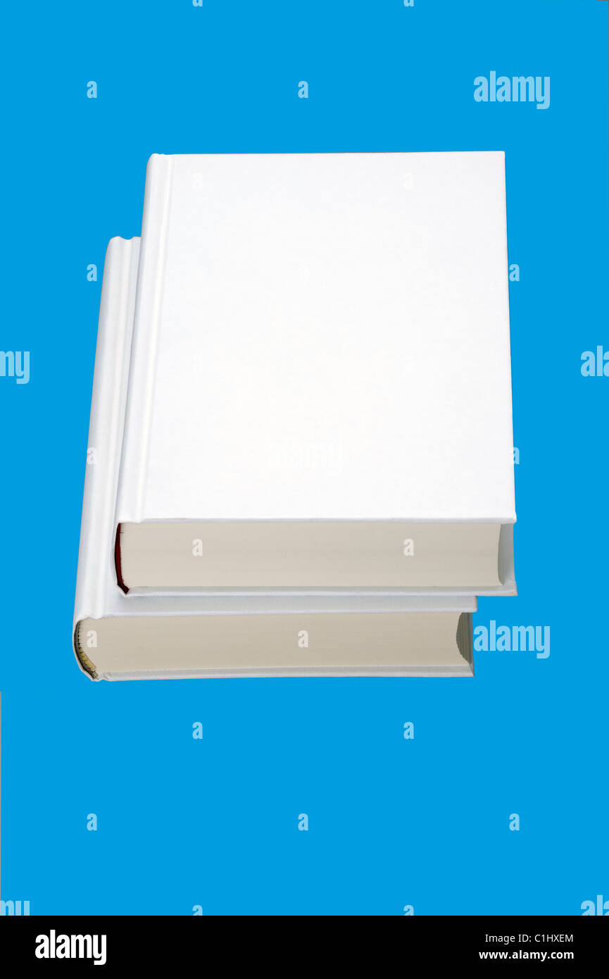 Two white books isolated on blue background, for design layout Stock Photo