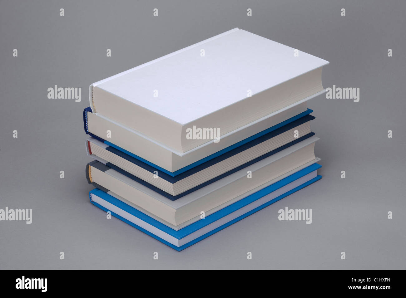 Stack of 5 books with white plain on the top, for design layout Stock Photo