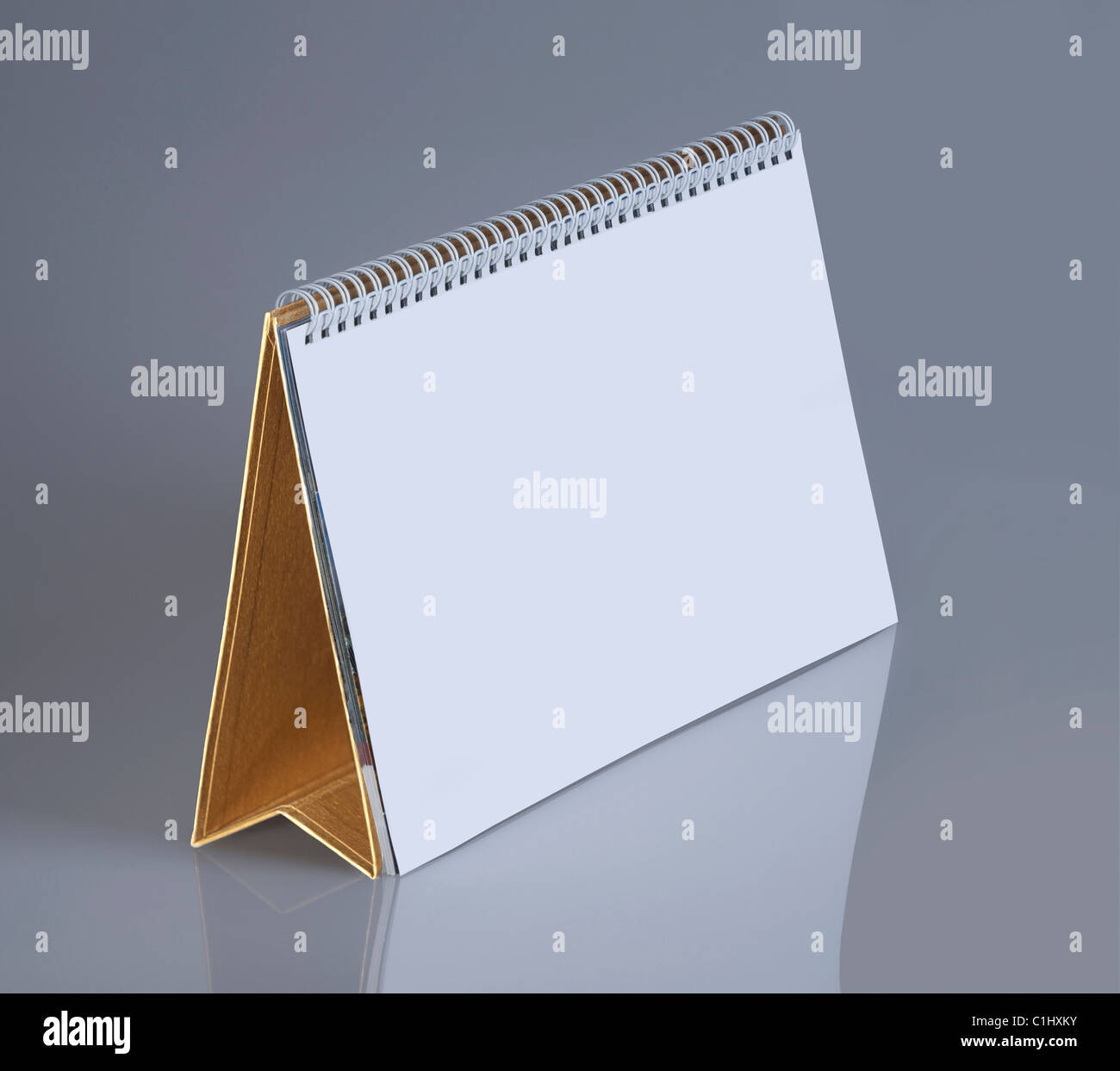 Plain desk calendar with a gold stand for design layout Stock Photo