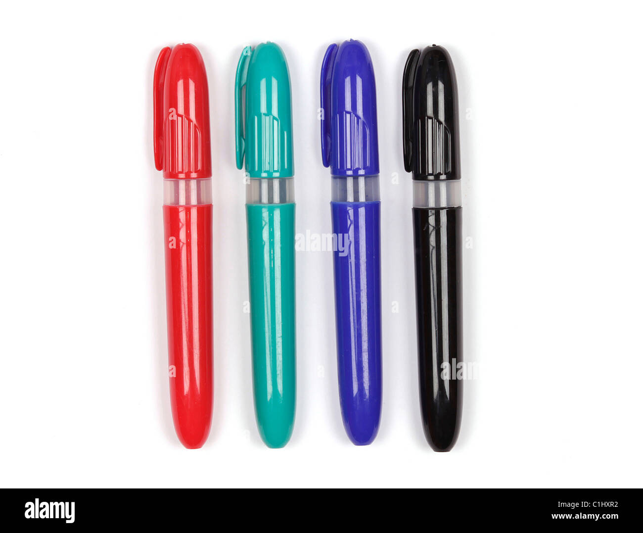 Four different coloured felt tip marker plans on a white background Stock Photo