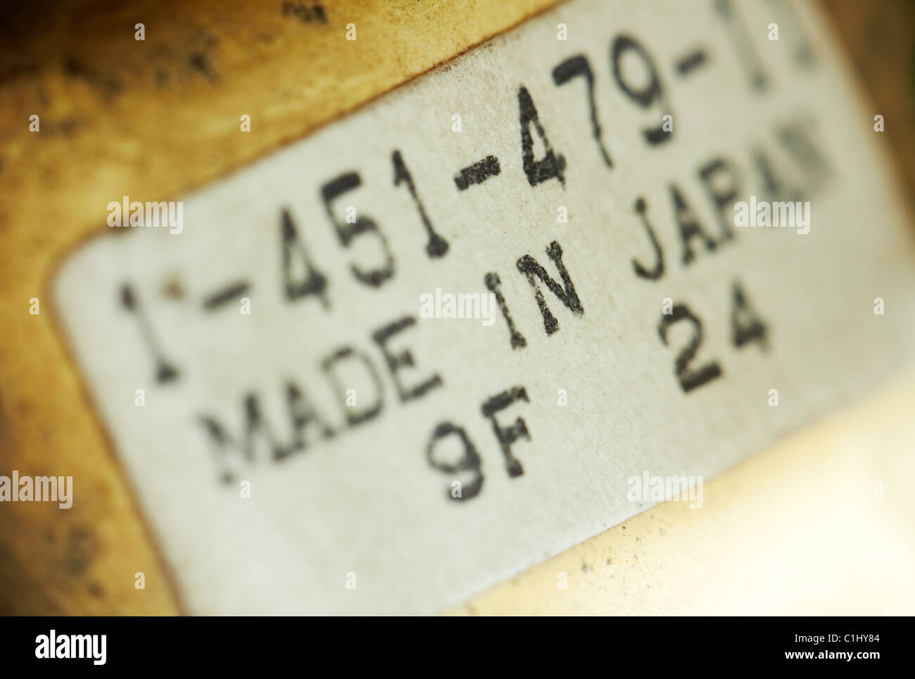 Macro of a label sticker, dusted. Stock Photo
