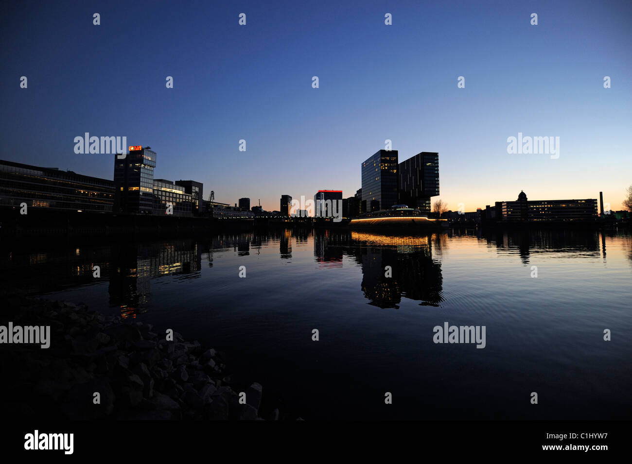 Hyatt Hotel and harbour basin in Duesseldorf in the evening. Stock Photo