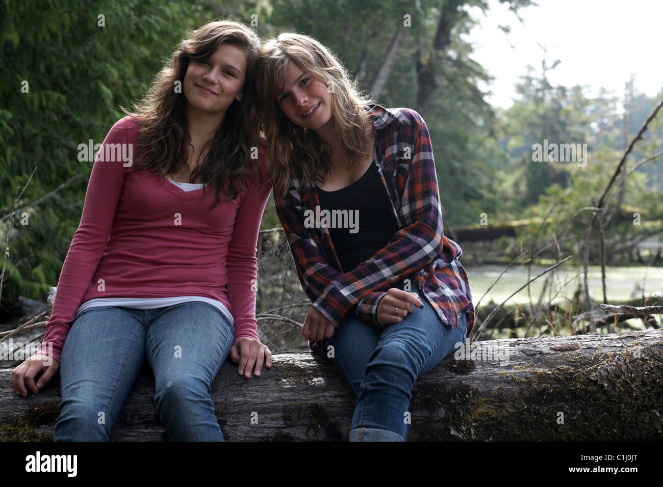 Portrait of Two Teenage Girls, Jensen's Bay, Tofino, Vancouver Island, British Columbia, Canada Stock Photo