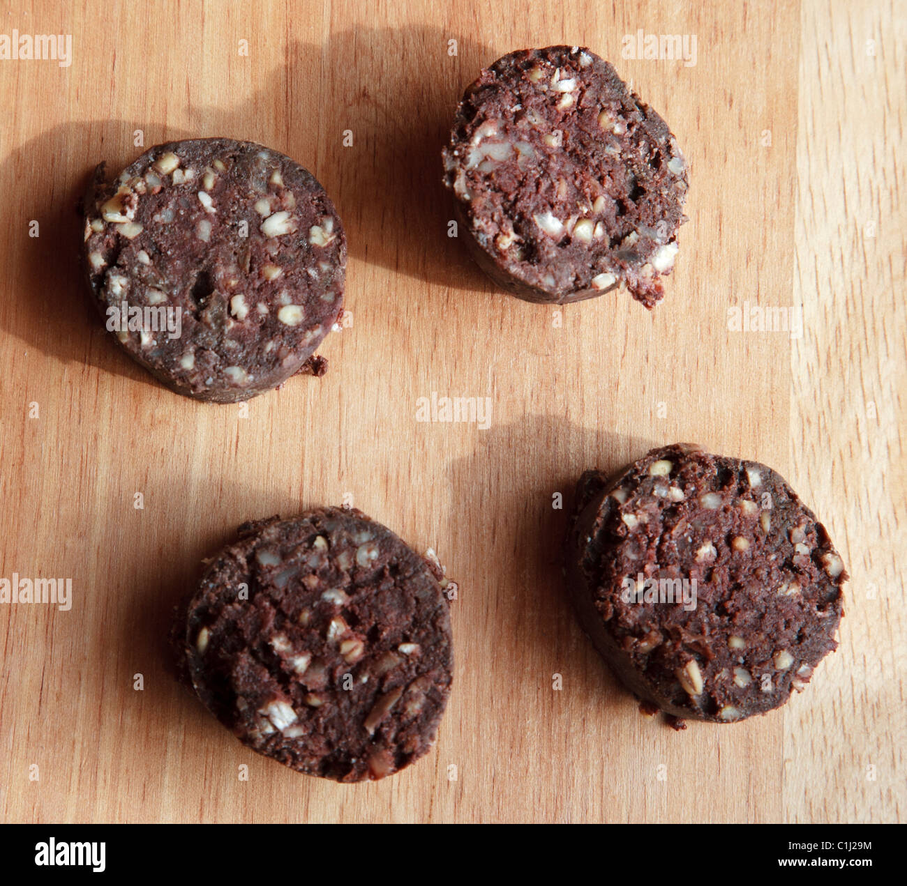 sliced black Pudding on kitchen board offal Stock Photo